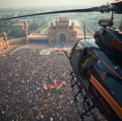 Aero Divine helicopter flying over Indian political rally in Delhi, election operations